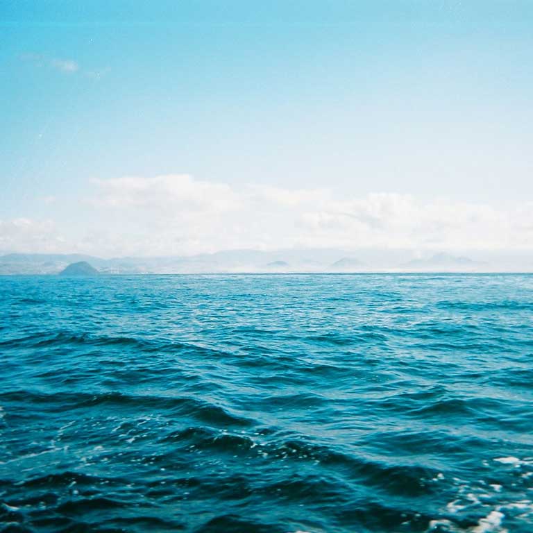 A body of water with a land in the distance