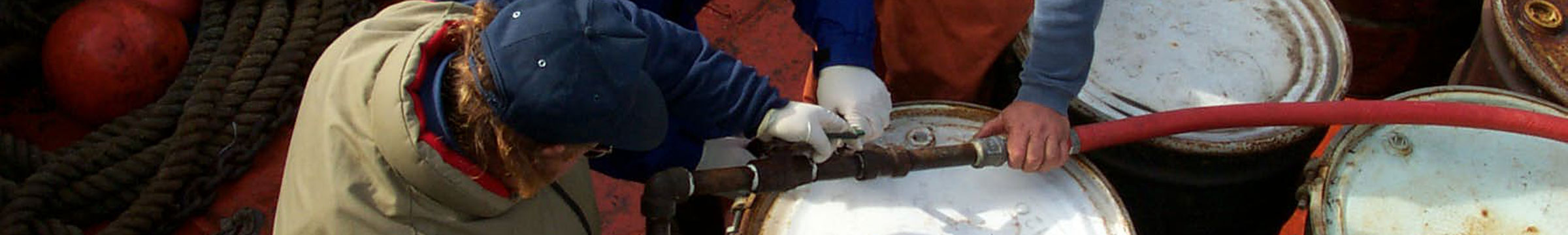 A group of people working on a pipe